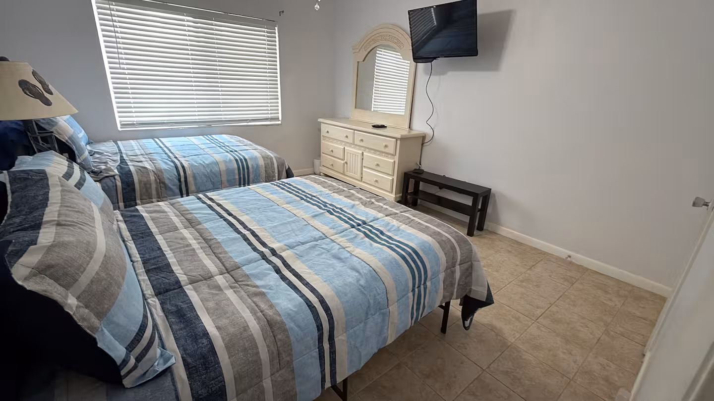 Two full-size beds at Marlin 305 Cocoa Beach condo