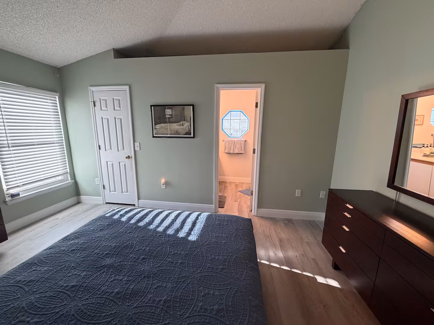 Primary bed at Palm Bay Retreat vacation rental