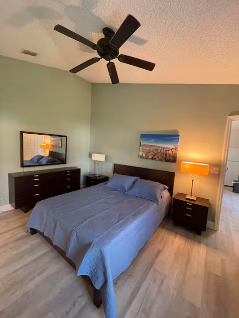 Primary bedroom at Palm Bay Retreat